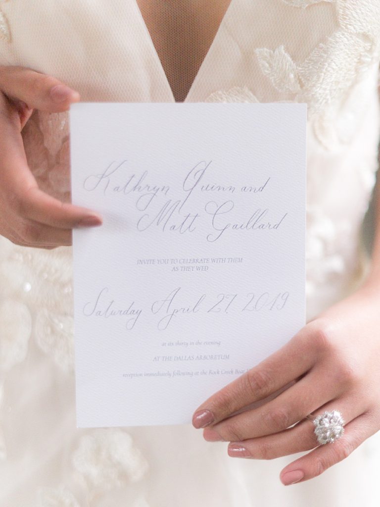 Bride holding an Invitation by Calligraphette and Co at Cornell University in Ithaca New York. Photo by New York Wedding Photographer, Manda Weaver Photography